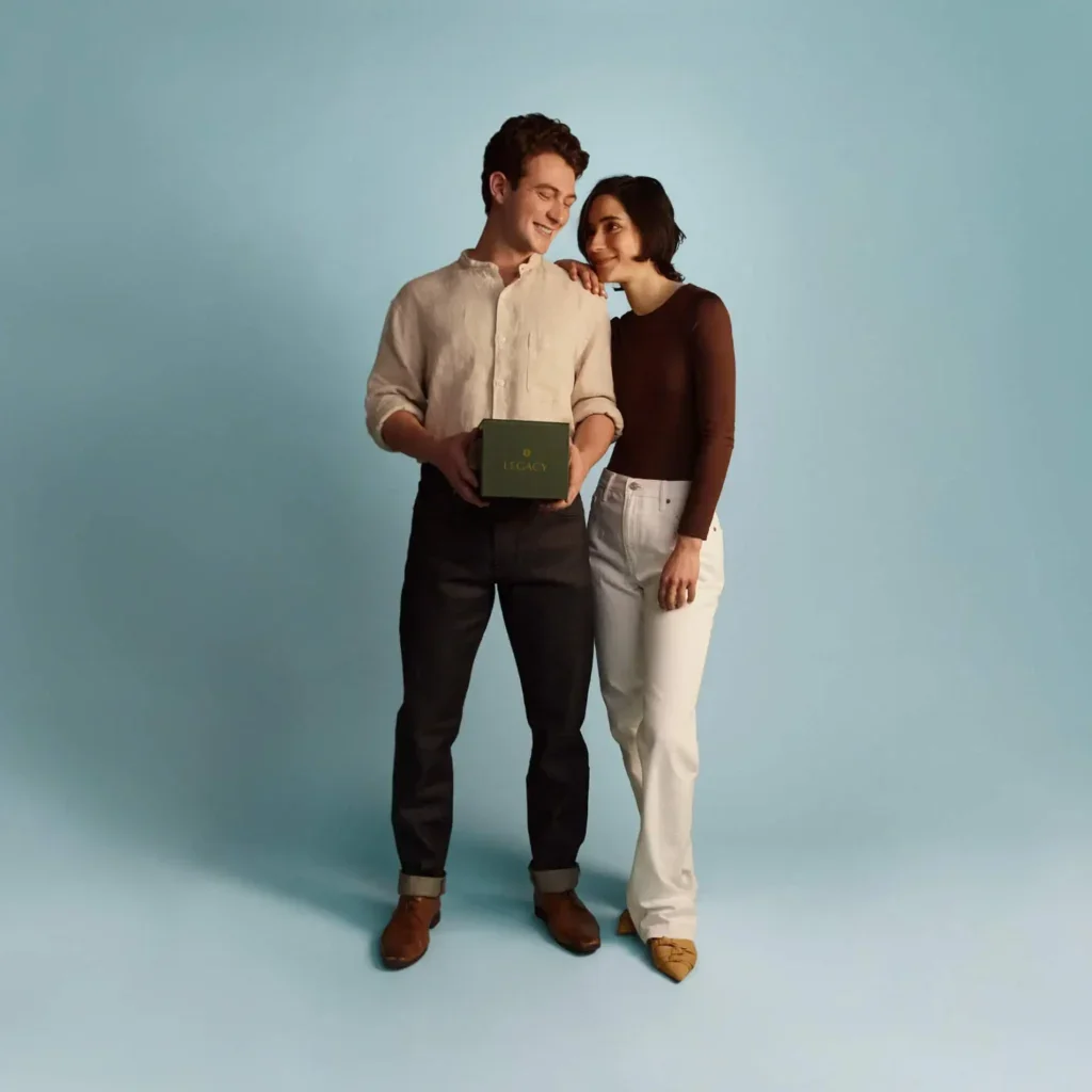 Man and woman couple holding the Legacy sperm testing kit